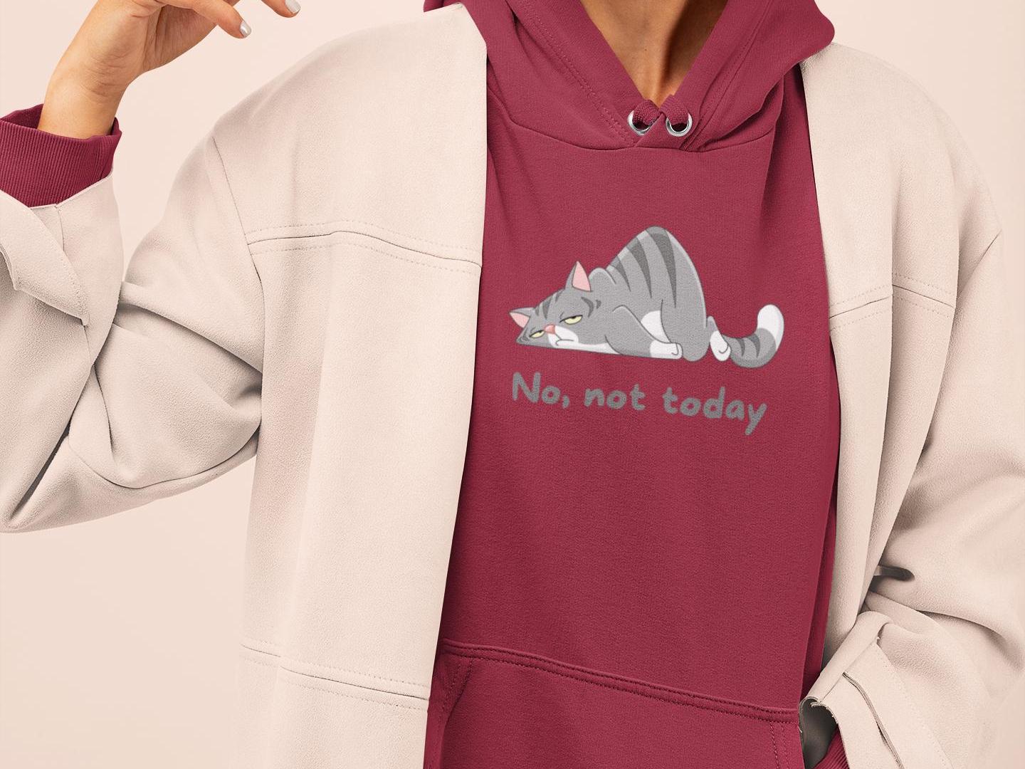 a woman wearing a red hoodie with a cat on it