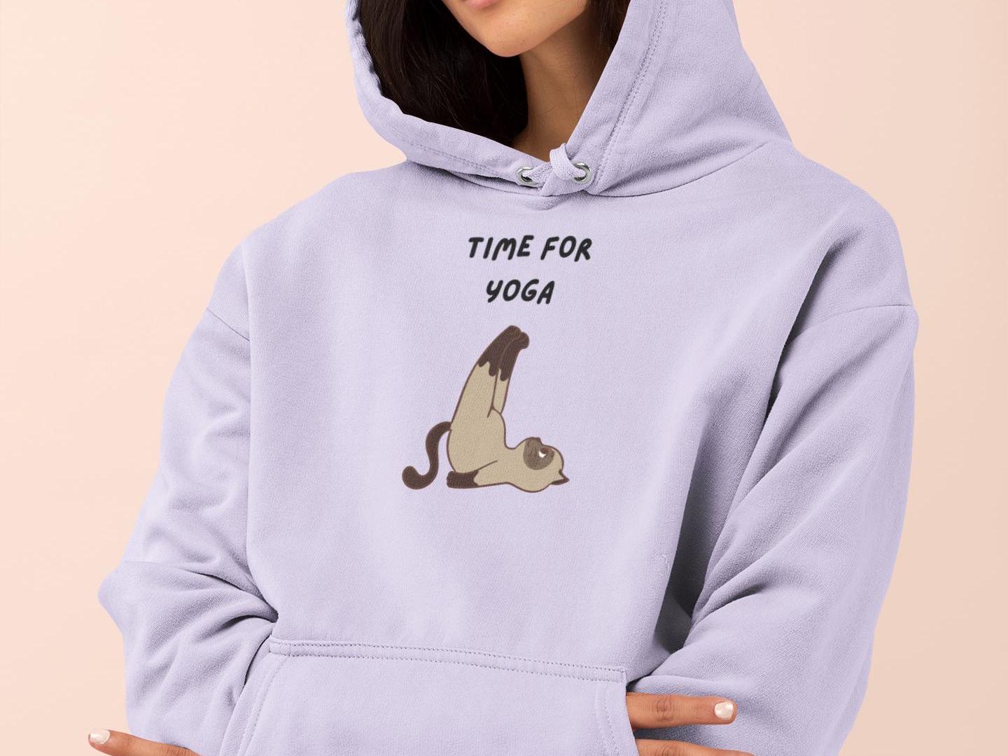 a woman wearing a hoodie that says time for yoga