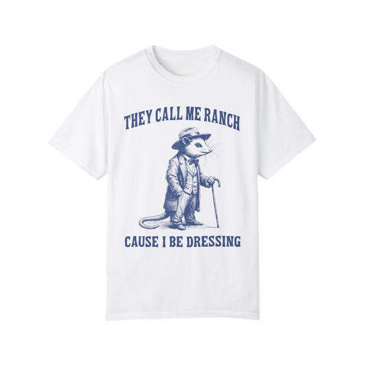 a white t - shirt with a picture of a raccoon holding a cane
